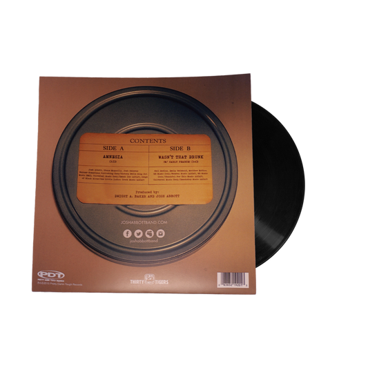 Vinyl record album with visible sleeve and disc partially removed.