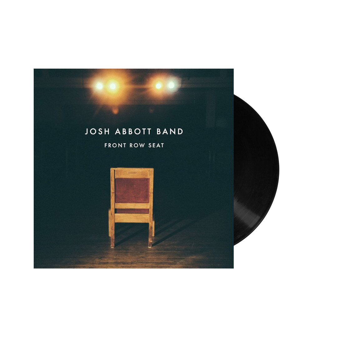 Vinyl record album cover featuring a wooden chair under spotlights.