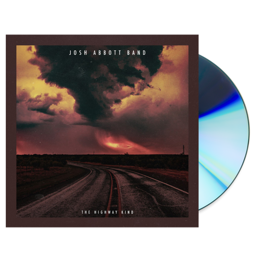Album cover featuring a stormy sky over a winding road, with a CD partially visible.